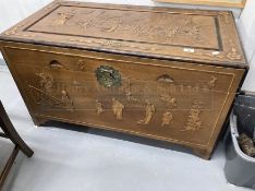 20th cent. Chinese camphor wood marriage chest decorated with stylised figures. 42ins. x 22ins.