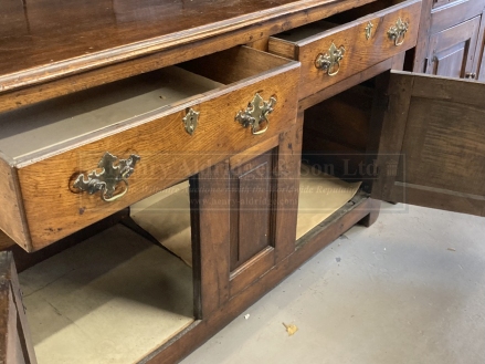 19th cent. Rustic oak dresser, open rack above two drawers and two cupboards. 57½ins. x 85ins. x - Image 2 of 4