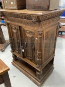 Late 19th/early 20th cent. Oak Gothic Revival cupboard with carved doors and Greek key decorated