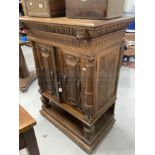 Late 19th/early 20th cent. Oak Gothic Revival cupboard with carved doors and Greek key decorated