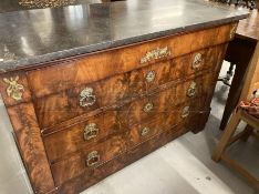 Empire mahogany and ormolu mounted commode, the grey marble top above four long drawers on shaped