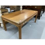 Mid 20th cent. Teak coffee table with Nathan Manufacturers label to underside. 36ins. x 21ins.