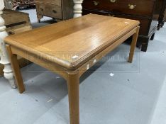 Mid 20th cent. Teak coffee table with Nathan Manufacturers label to underside. 36ins. x 21ins.