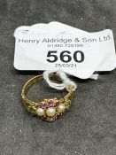 Hallmarked Victorian Jewellery: 15ct gold cluster set with three half pearls, surrounded by six