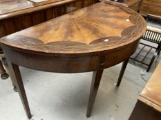 Georgian mahogany, satinwood and marquetry dressing table the demi lune top enclosing a fitted