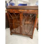 19th cent. Figured mahogany glazed display cabinet, inlaid with a geometric design. 43½ins. x 13ins.