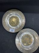 20th cent. White and gilt metal dishes with a border depicting animals, the centre of one embossed