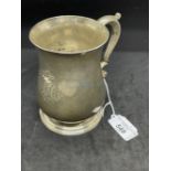 Hallmarked Silver: Georgian tankard of plain baluster form, scrolled handle on a stepped foot.