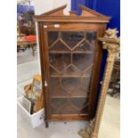 19th cent. Mahogany astragal corner display cabinet on three supports with broken pediment cornice,.