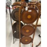 Early 20th cent. Mahogany 3 tier cake stand, central inlaid motifs and banded rings. The whole on