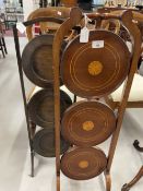Early 20th cent. Mahogany 3 tier cake stand, central inlaid motifs and banded rings. The whole on