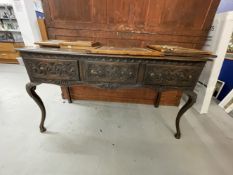 19th cent. Carved Gothic oak buffet on cabriole supports.