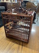 20th cent. Mahogany Chinese birds cage with carved plaques & spandrels, bottom catch tray and hidden