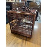 20th cent. Mahogany Chinese birds cage with carved plaques & spandrels, bottom catch tray and hidden