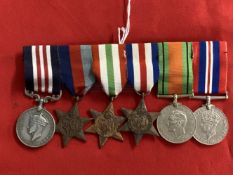 Militaria: WWII British Medal group with a reproduction Military Medal, 39-45 Star, Italy Star,