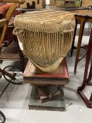 African tribal drum and stand of books, made of plaster.