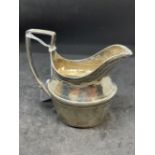 Hallmarked Silver (Irish): Cream jug reed patterned handle with bright cut engraving. Hallmarked
