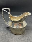 Hallmarked Silver (Irish): Cream jug reed patterned handle with bright cut engraving. Hallmarked