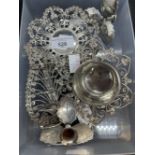White metal tea strainer and stand, toast rack, all with leaf and scroll decoration,