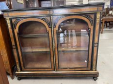 19th cent. Empire style ebonised display cabinet inlaid with walnut and exotic woods in a