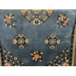 Carpets & Rugs: 20th cent. Chinese carpet, blue ground with floral/botanical decorations. Three