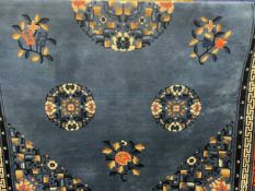 Carpets & Rugs: 20th cent. Chinese carpet, blue ground with floral/botanical decorations. Three