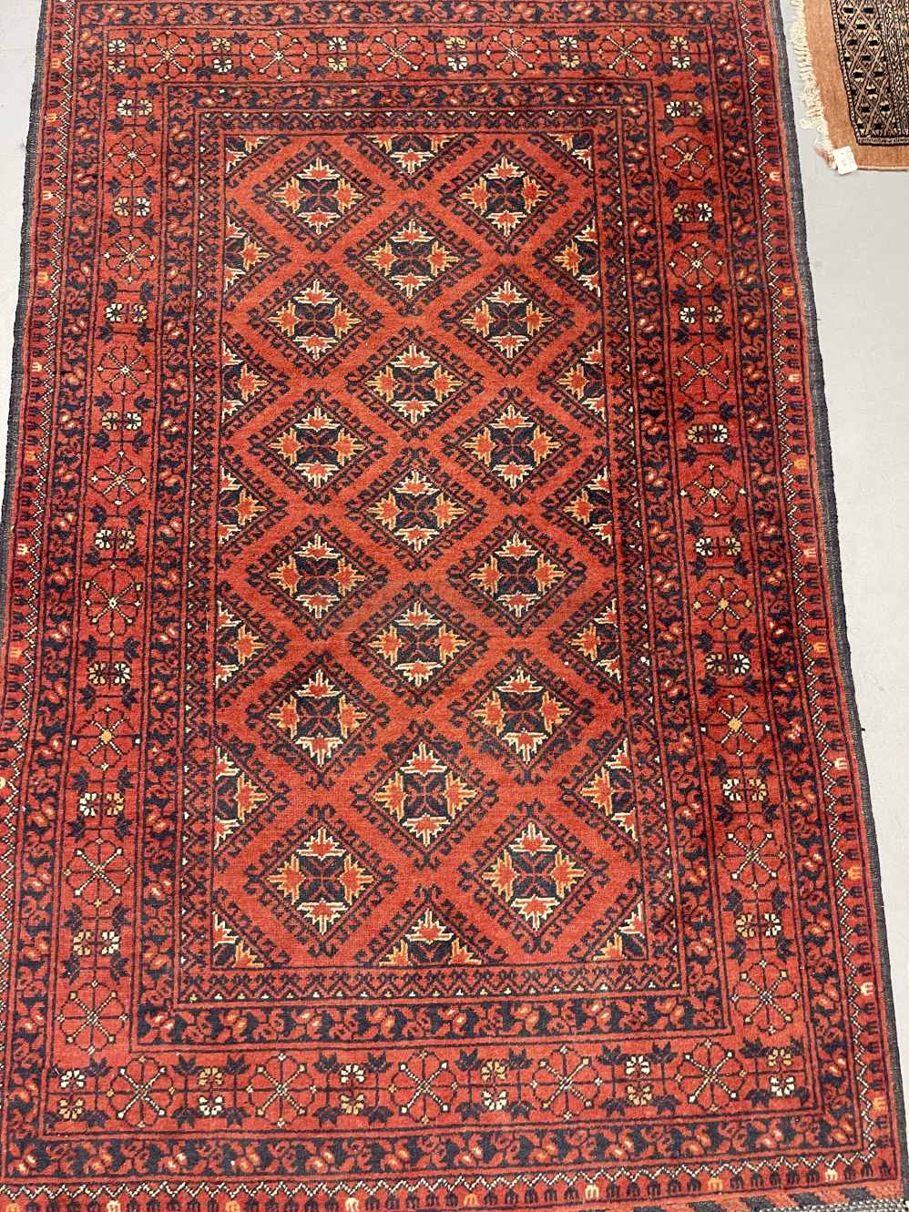 Carpets & Rugs: 20th cent. Turkman woolen carpet, red ground, six borders, geometric stylised