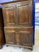 17th cent. Style oak cupboard with foliate carved stiles and inlaid bottom section, with stile feet.