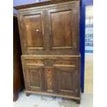 17th cent. Style oak cupboard with foliate carved stiles and inlaid bottom section, with stile feet.