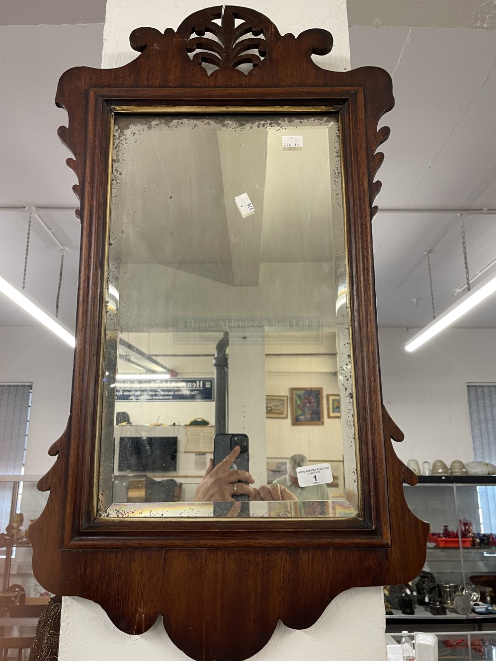 19th cent. Mahogany mirror, fretwork surround with acanthus finial.