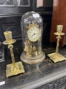 20th cent. Domed brass mantel clock 12ins. Plus a pair of 19th cent. Brass candlesticks. 9ins.