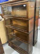 Early 20th cent. Oak Globe-Wernicke glazed sectional bookcase with four opening compartments. 58ins.