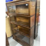 Early 20th cent. Oak Globe-Wernicke glazed sectional bookcase with four opening compartments. 58ins.