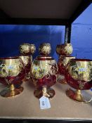 20th cent. Glass: Italian Murano gilt and red glass hock and brandy goblets. Six of each.