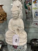 Chinese Blanc de Chine porcelain figures, Buddha seated in a Lotus posture, Guanjin standing