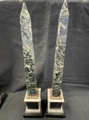 19th cent. Obelisk, multicolour marble on a black base, a pair. Height 16ins.