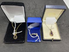 Hallmarked Gold: 9ct. Pendant with amethyst stones, another pendant, both with chains and a yellow