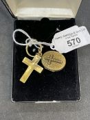 Yellow metal cross and oval locket. Both test as 9ct gold. Total weight 11.4g.