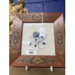 18th cent. Delft tiles, possibly Friesland, blue floral pattern, in later frames, a pair. 5½ins. x