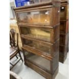 Early 20th cent. Oak Globe-Wernicke glazed sectional bookcase with four opening compartments, the