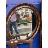 20th cent. Walnut and gilt embellished mirror plus an oval mirror.