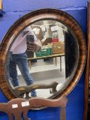 20th cent. Walnut and gilt embellished mirror plus an oval mirror.