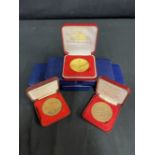 CUNARD: Collection of sixteen Queen Elizabeth II cased World Cruise medallions.