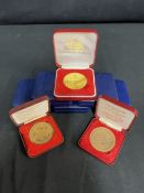 CUNARD: Collection of sixteen Queen Elizabeth II cased World Cruise medallions.