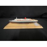 OCEAN LINER: Scale model of the Cunard Queen Elizabeth II by Maritime Replicas. Mounted on pine base