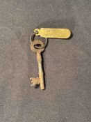 R.M.S. TITANIC: White Star Line company key and ring with brass tag stamped "SERVICE FORd "E" Deck".