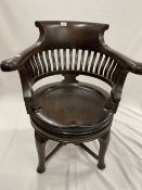 R.M.S. CARPATHIA: Extremely rare oak swivel chair with slatted back on club supports, impressed