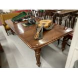 19th cent. Mahogany extending dining table with two leaves, rebated edge and reeded supports.