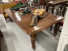 19th cent. Mahogany extending dining table with two leaves, rebated edge and reeded supports.