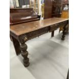 Late 19th/early 20th cent. Gothic carved oak serving table, the heavily carved frieze with central